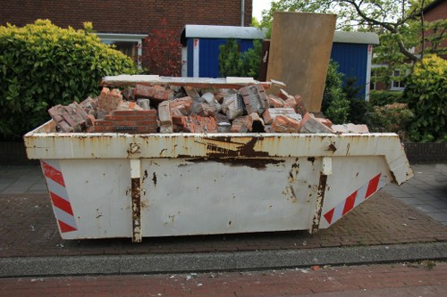 People donating furniture at a Swisscottage center